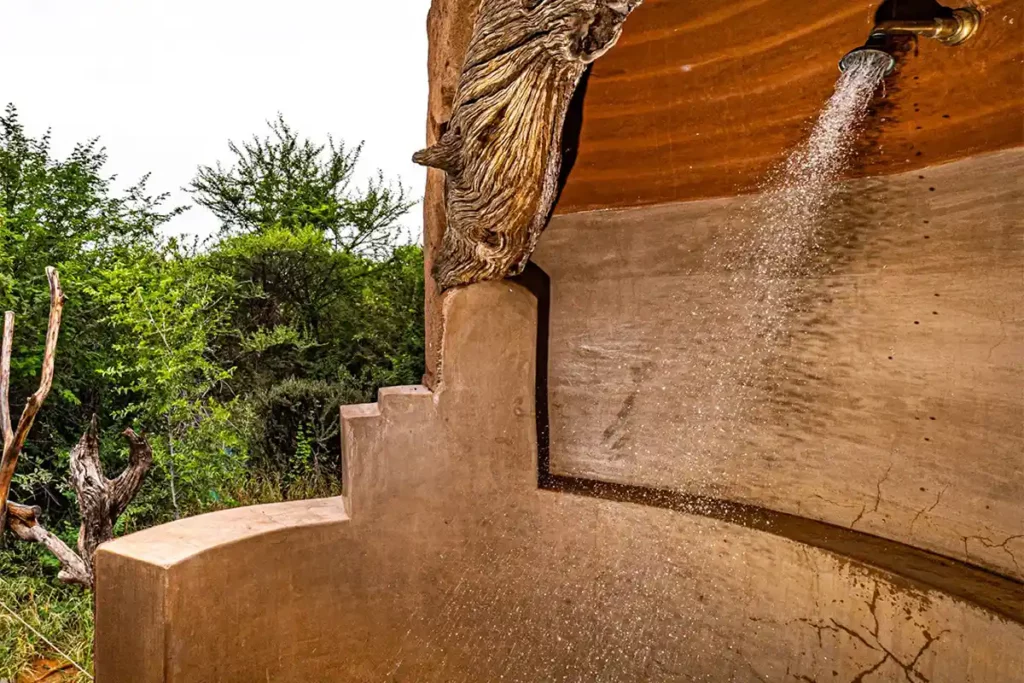Rustic private outdoor shower overlooking the bushveld.
